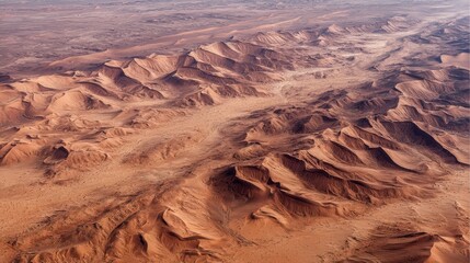 Fototapeta premium Aerial View of Desert Terrain with Unique Rock Formations