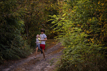 Obraz premium two kids playing on country road