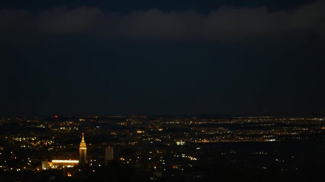 night city scape view againts cloudy sky