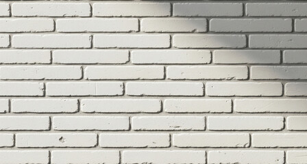 Obraz premium Clean white brick wall texture illuminated by soft shadows, creating a bright and modern background for various design needs