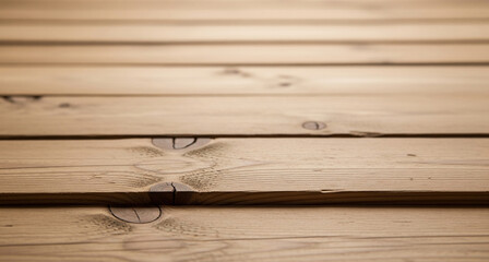 Warm natural wooden decking surface with visible grain and knots offering a rustic and organic background texture
