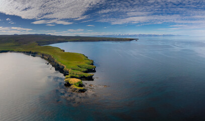 view of the coastline and Manarbakki Peninsula near Husavik in northern Iceland