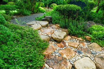 Garden landscape design with pathway in garden and footpath in picturesque summer park and...