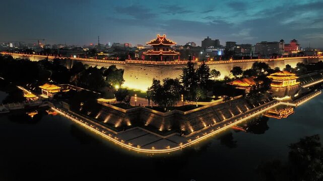 Aerial drone view of Corner Tower on ancient city wall of Xian city at night in Shanxi, China