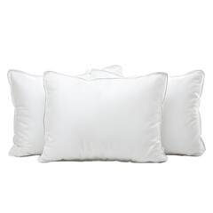 A set of three soft white pillows isolated against a black background, comfort