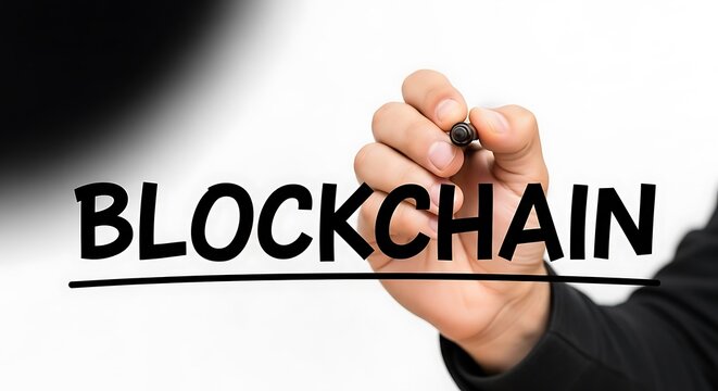 Close up of a hand writing the word blockchain on a white background - Powered by Adobe