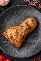 Chicken leg, quarter grilled with spices and rosemary. Chicken leg
