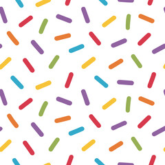 Seamless pattern of colorful sprinkles isolated on white background for a festive and fun celebration