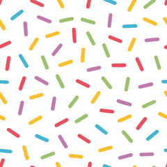 Seamless pattern of colorful sprinkles isolated on white background for a festive and fun celebration