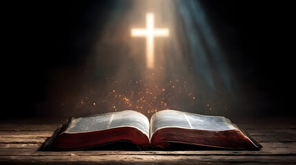 Fototapeta premium Bible with glowing cross and light rays in dark background 