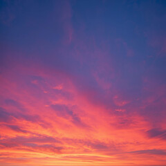 Vibrant Magenta Sunset Sky Illuminated With Soft Clouds and Orange Horizon Creating Dramatic Scene