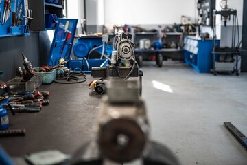 This collection of high-resolution images captures the intricate process of repairing and assembling electric motors inside a professional industrial workshop.