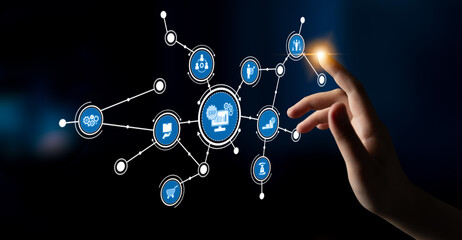 A hand reaches out to interact with a digital touchscreen displaying various icons representing technology, innovation, and connectivity in a seamless environment. Tessel