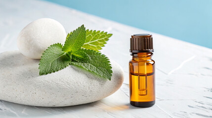 Relaxing spa scene with essential oils and mint leaves on marble surface for aromatherapy and calm