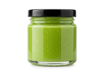 Delicious green pesto in a glass jar with black lid, perfect for healthy cooking and culinary creations