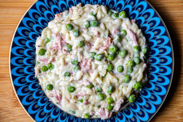 Bowl of Italian Style Orzo With Smoked Ham and Garden Peas
