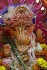 Ganapati festival celebration at home with a beautifully decorated Ganesh idol, flowers, lights, and traditional offerings, symbolizing devotion, prosperity, and cultural heritage in a festive atmosph