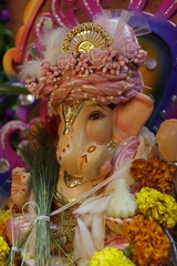 Ganapati festival celebration at home with a beautifully decorated Ganesh idol, flowers, lights, and traditional offerings, symbolizing devotion, prosperity, and cultural heritage in a festive atmosph