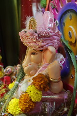 Ganapati festival celebration at home with a beautifully decorated Ganesh idol, flowers, lights, and traditional offerings, symbolizing devotion, prosperity, and cultural heritage in a festive atmosph