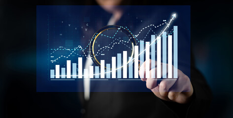 A business professional examines financial data represented through dynamic graphs and charts, emphasizing growth trends and market analysis in a digital setting. Impute