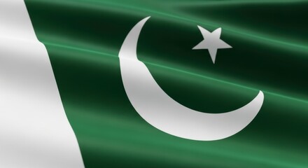 A close up of the flag of pakistan waving with a white crescent and star on green field