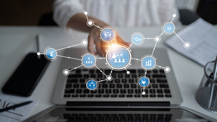 Visual representation of digital connection with icons over a laptop screen, symbolizing modern communication and collaboration in a professional workspace setting. Tessel
