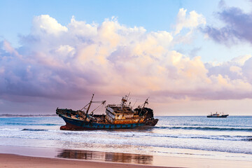 Fototapeta premium Butwani bridge and Malindi Pier area is a popular waterfront location known for stunning sunrises over the Indian Ocean. The pier is a concrete jetty that stretches about 400 meters into the ocean and