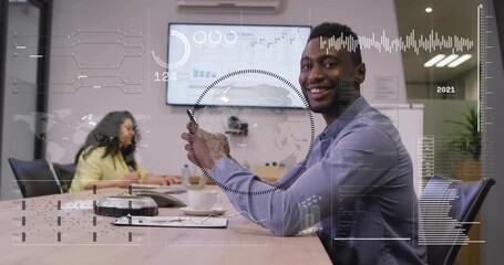 male professional tapping smartphone on meeting table, generating animated business data overlay - Powered by Adobe