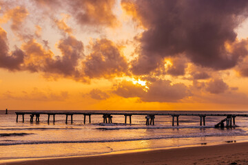 Fototapeta premium Butwani bridge and Malindi Pier area is a popular waterfront location known for stunning sunrises over the Indian Ocean. The pier is a concrete jetty that stretches about 400 meters into the ocean and