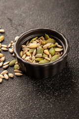 Seed mix sunflower seeds and pumpkin seeds natural product tasty snack fresh delicious gourmet food background on the table rustic top view copy space keto and paleo diet vegan and vegan food