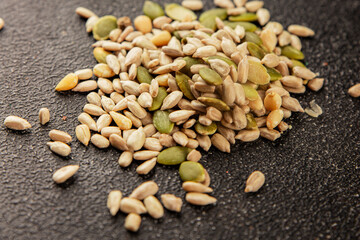 Seed mix sunflower seeds and pumpkin seeds natural product tasty snack fresh delicious gourmet food background on the table rustic top view copy space keto and paleo diet vegan and vegan food