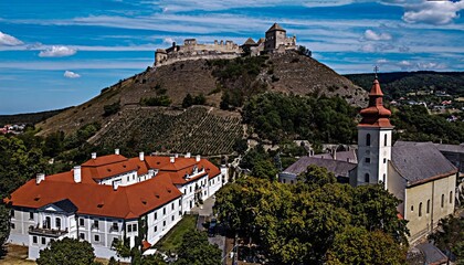 Obraz premium Hilltop Castle Overlooking a Historic Town