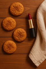 Cinnamon Cookies with Red Lipstick on Wooden Table