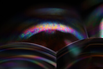 Bright rainbow reflection of liquid in macro, silver colors, surrealistic background, fantastic smooth movement, silver concept, silver ink