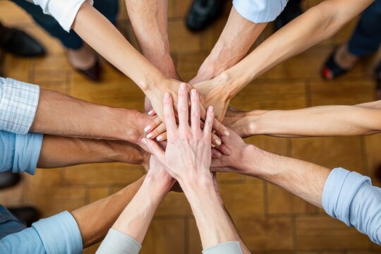 Concept of teamwork and cooperation - hands of business people in a scrum. Colleagues together, team building, business project.