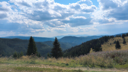 Lush green valley and mountains dominating the landscape under blue sky