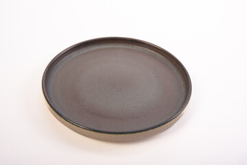 Beautiful ceramic pot placed on a white background, selective focus.