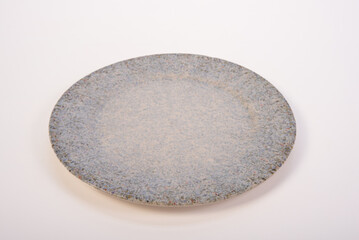 Beautiful ceramic pot placed on a white background, selective focus.