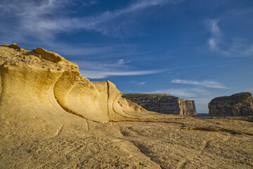 Sand-colored limestone formations located in Dwejra on the island of Gozo, Malta.