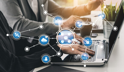 Close-up view of hands typing on a laptop, surrounded by digital icons representing technology connections. Ideal for themes of innovation, communication, and digital collaboration. Tessel