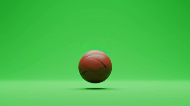basketball slowly bouncing in place on green screen
