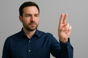 Office worker interacting with invisible touchscreen using two fingers gesture on gray background