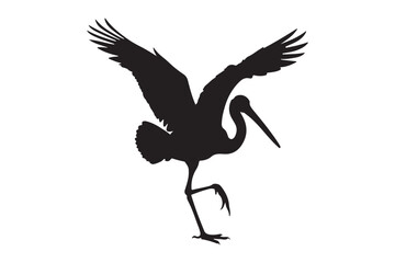 Silhouette of a crane with wings outstretched in flight