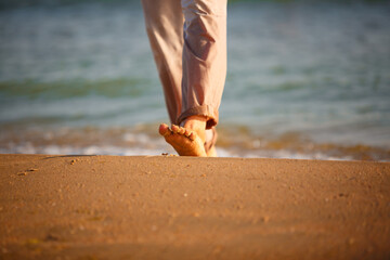close up of a man legs on a beach