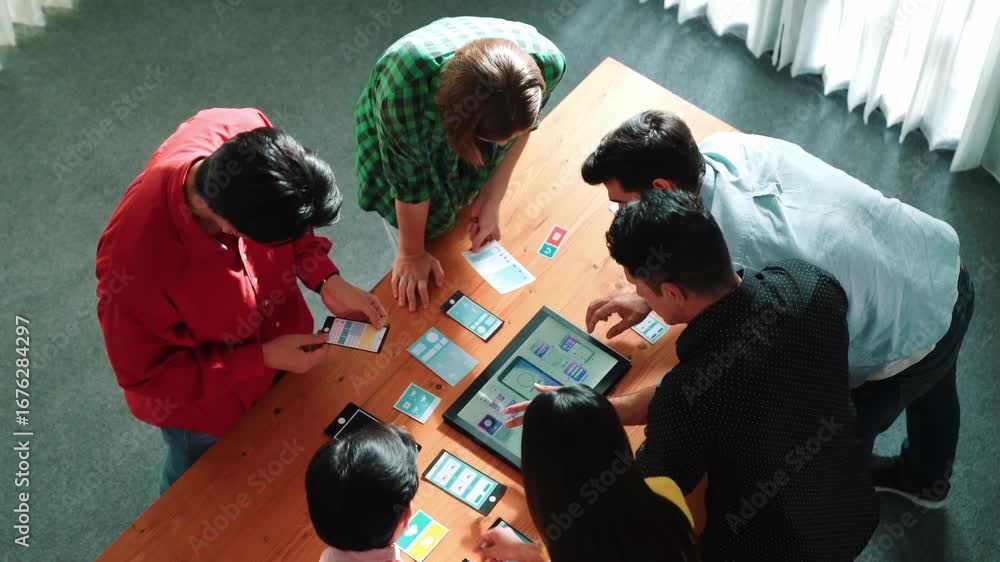 Aufkleber top view of diverse business people discussing idea and designing system while using tablet with ux,