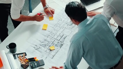 Top view of professional architect engineer team writing sticky notes and sticking note at meeting table while interior designer talking and discussing about building exterior designing. Alimentation. - Powered by Adobe