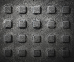 close-up of the texture of the hatch painted over with black paint with a cubic pattern