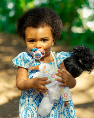 Beautiful black girl, 1 year and 5 months old, playing in nature. Beautiful baby, African baby....