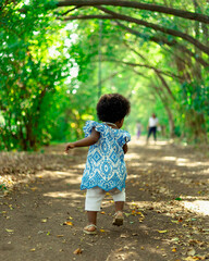 Beautiful black girl, 1 year and 5 months old, playing in nature. Beautiful baby, African baby....