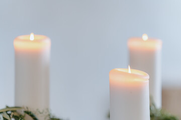 Soft Glow of Burning Candles in Peaceful Setting